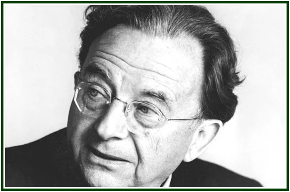 Retrato fotográfico em plano aproximado e a preto e branco do psicanalista Erich Fromm, focado de perfil parcial enquanto usa os seus óculos de armação fina, cuja perspetiva humanista ajuda a analisar a experiência do satori.